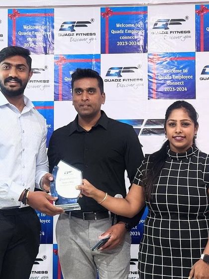 A proud moment for Mr. Madhu and our leadership team as he accepts his 'Extra Miles' award. Our trainers are the heart of our gym.