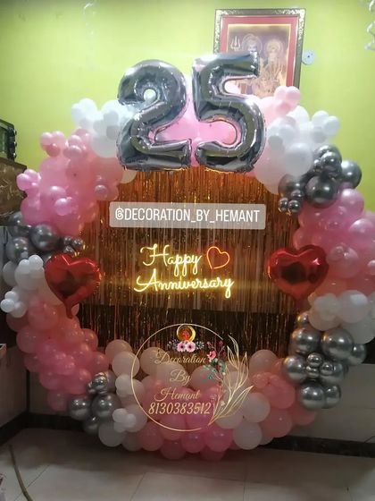 A closer look at the 25th anniversary balloon ring. This shows how the different balloon sizes and colors, from pastel pink to chrome silver, come together to create a rich, textured look.