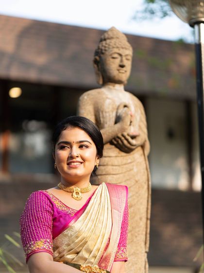 A close-up of the bride's gentle smile. The makeup is designed to look fresh and radiant, enhancing her natural happiness.
