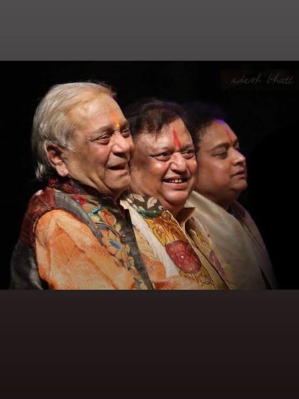 A cherished photograph of three generations of Gurus: Pt. Birju Maharaj, Pt. Jai Kishan Maharaj, and Tribhuwan Maharaj, representing the continuity of our artistic lineage.