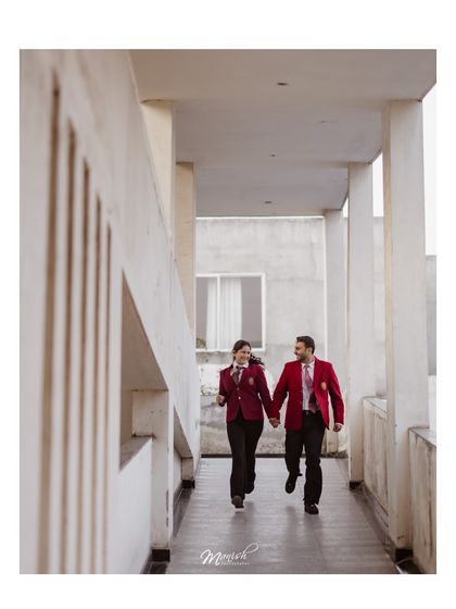 A candid shot of the couple running through the school hallway, full of energy and happiness, celebrating their journey from classmates to soulmates.