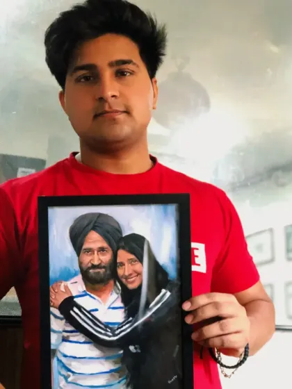 Holding up the finished A4 size oil painting of a father and daughter for my client in Canada. A beautiful bond captured forever.