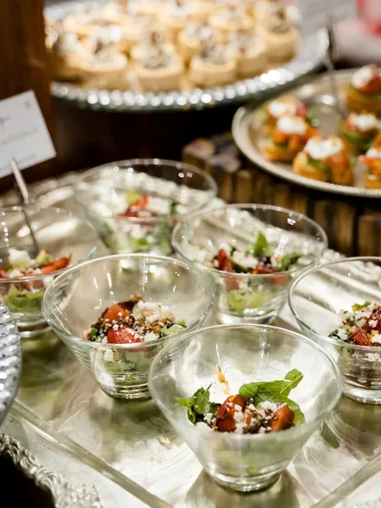 Mini salad bowls served at the Gazal Gupta event. These individual portions of fresh salad were a light and elegant addition to the grazing table.