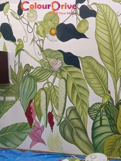 We brought this vibrant, tropical jungle to life with a completely freehand painted mural. This type of custom wall art allows for unparalleled creativity, turning a plain wall into a one of a kind masterpiece that reflects your personal style.