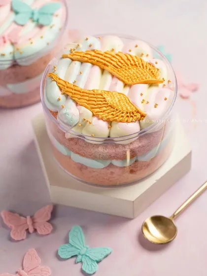 If you like your dessert to be whimsical and delicious, my Vanilla & White Chocolate Mousse Cake Tubs are perfect. This one is decorated with golden wings for an angelic touch.