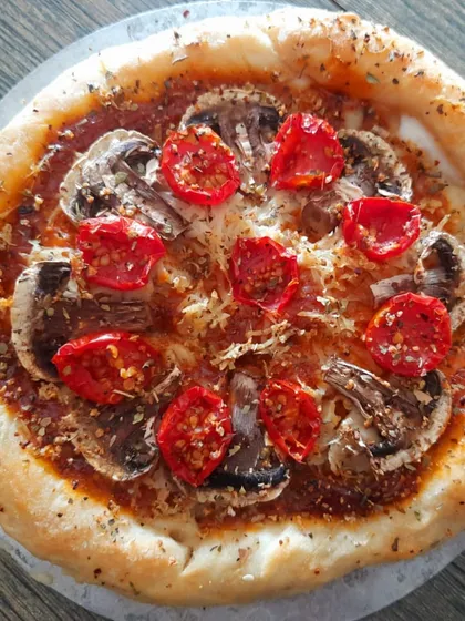 A crowd favourite, my stuffed-crust vegan pizza. This one features a gluten-free base, juicy mushrooms, and sweet cherry tomatoes, all topped with my creamy, homemade plant-based cheese. It proves that pizza can be both indulgent and healthy.