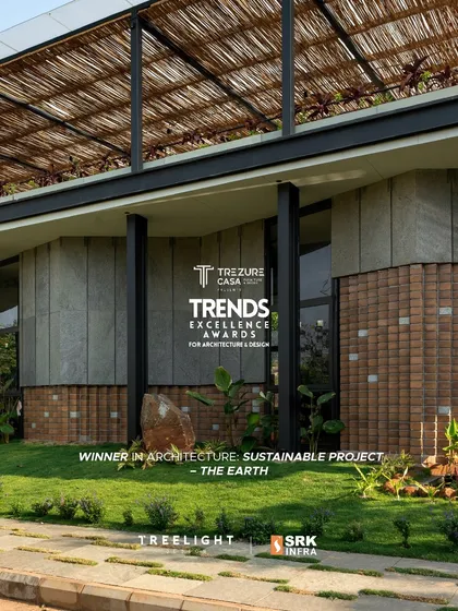 'The Earth' was named a winner in the 'Sustainable Project' category at the Trends Excellence Awards. This image showcases the building's harmonious relationship with its green landscape, highlighting the use of natural materials.