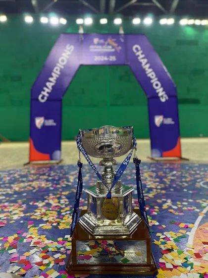 The prize we hunted all season. The AIFF Futsal Club Championship trophy sits proudly on the court, surrounded by the confetti of our victory celebration.