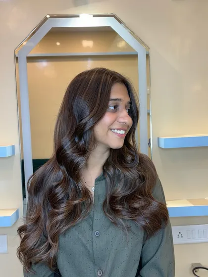 This client is glowing with her new light brown and beige blonde hair. The colors are perfectly blended for a seamless finish.