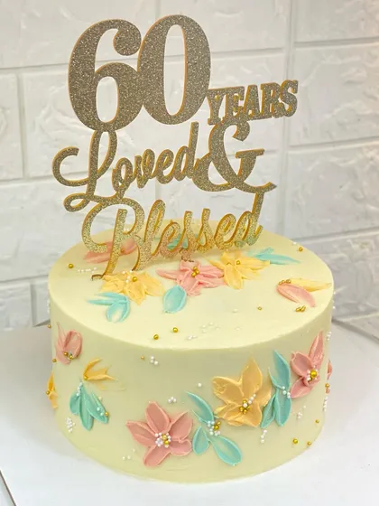 The full view of the "60 Years Loved & Blessed" cake.
