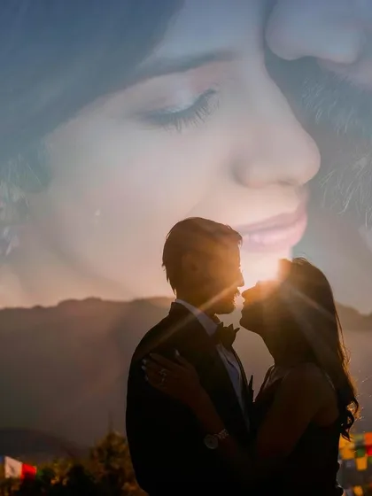 A powerful and artistic silhouette against a golden sunset. This double exposure image blends the couple's kiss with a close-up portrait, creating a deeply romantic and symbolic photograph.