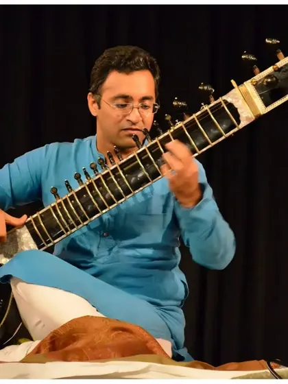 A focused shot during the recital at IIC Delhi, highlighting the technical aspects of my playing.