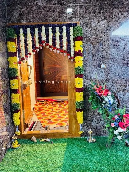 A different perspective of the colorful door garland setup, showing how it brightens the entryway and complements the home's interior.
