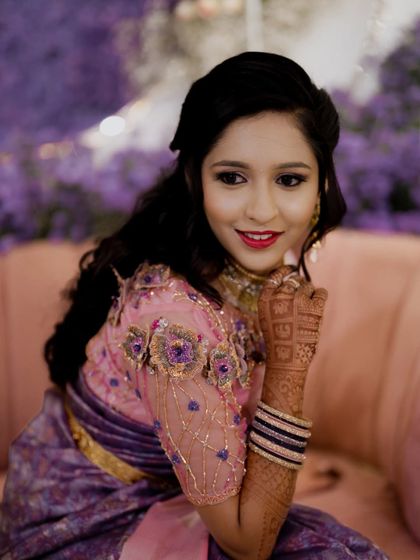 A beautiful portrait of the bride at her reception, highlighting her elegant saree and makeup.