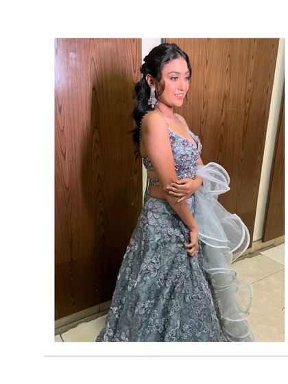 A stylish look for a sangeet or cocktail night. This grey sequined crop top lehenga is modern, glamorous, and guaranteed to make you the center of attention.