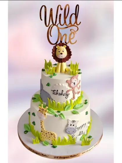 The same jungle theme cake with a "Wild One" topper, perfect for celebrating a first birthday in style.