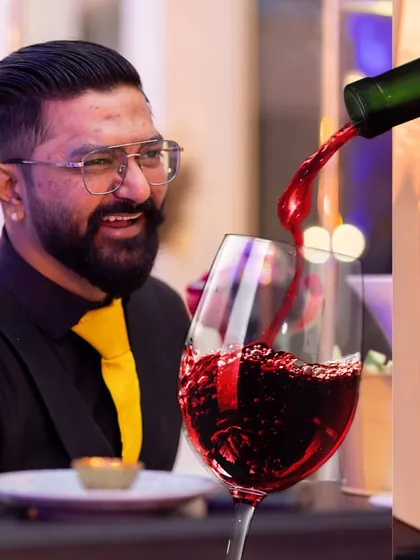 The joy on our bartender's face as he pours a glass of red wine says it all. We are truly passionate about what we do.