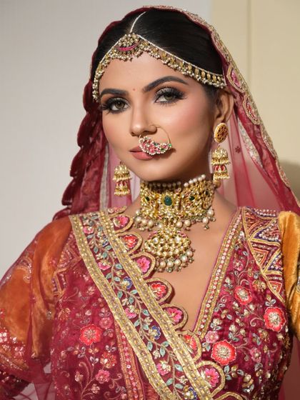 A breathtaking bridal look that turns dreams into reality. The bold eye makeup and traditional jewelry create a powerful and regal statement.