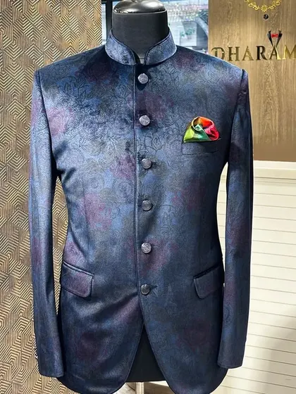 A full view of the navy multi-tonal floral bandhgala on a mannequin. The fit is sharp and the pattern is sophisticated, making it ideal for a reception or sangeet.