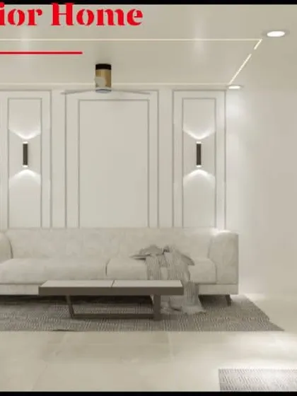 A view focusing on the living area's feature wall with classic molding and elegant wall sconces. The minimalist sofa and coffee table keep the look clean and contemporary.