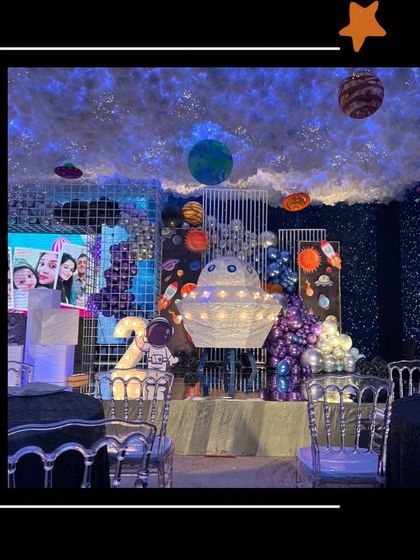 Curiosity is the essence of existence. This space theme was designed to celebrate a curious kid's birthday, with elements like a UFO, planets, and a starry backdrop to fuel his imagination.