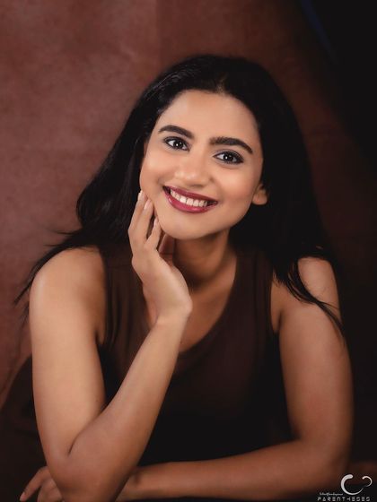 The same setup, but with a bright, engaging smile. This shows the range of expression I can capture in a single session, from pensive to joyful.