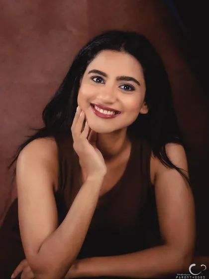 The same setup, but with a bright, engaging smile. This shows the range of expression I can capture in a single session, from pensive to joyful.