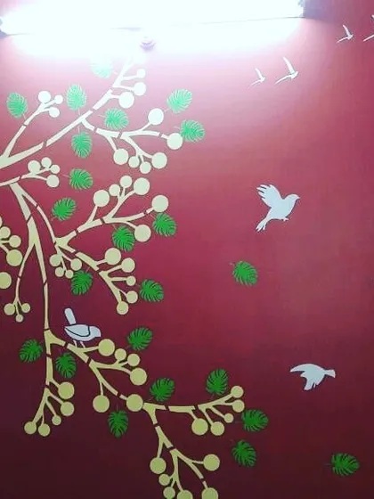 This tree and bird stencil design is shown here on a bold red wall. We can adapt our popular nature designs to any color scheme to match your existing home decor.