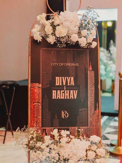 The welcome sign for the 'City of Dreams' party, designed with a New York skyline graphic to immediately establish the theme.