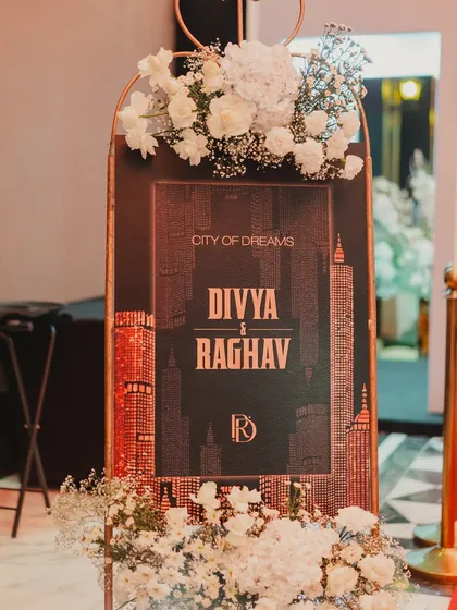 The welcome sign for the 'City of Dreams' party, designed with a New York skyline graphic to immediately establish the theme.