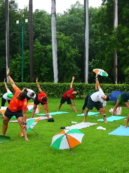 Practicing a standing side bend, a great yoga pose for stretching the obliques and improving spinal flexibility.