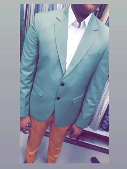 This client opted for a light green blazer paired with contrasting trousers. This shows how a custom blazer can add a pop of color to your wardrobe.