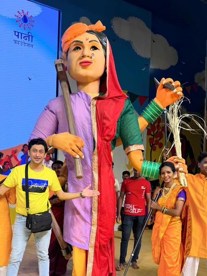 Standing proudly with the giant Bali Raja puppet, which symbolizes the victory of the farmer's movement. Creating these massive characters for Aamir Khan's Paani Foundation was a fulfilling project that blended art with a powerful social message.