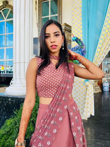 A confident and stylish portrait. The makeup enhances her features beautifully, making her stand out.