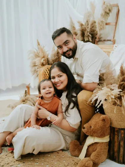 A classic family portrait with a modern boho twist. The warm, neutral tones create a timeless and elegant look.