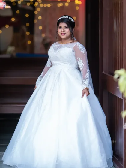 A beautiful full-length portrait of the bride in her princess-style gown. She looks absolutely radiant and ready for her big day.