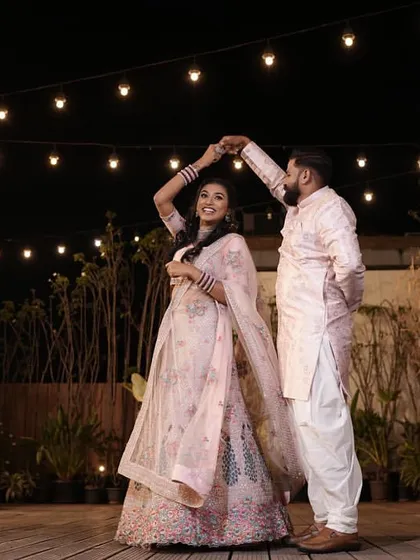 A candid moment of a couple dancing under the stars on our rooftop deck.