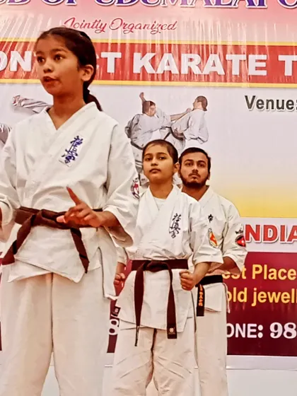 A senior female student giving instructions to her juniors before their performance. This is how we build leadership skills.