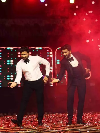 A sangeet is incomplete without a performance from the brothers. Here, the groom and his brother take the stage for a "Bade Miyan, Chote Miyan" style dance that was a total crowd-pleaser.
