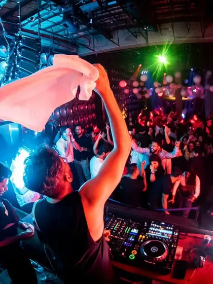 Waving a towel to hype up the crowd at Roxy. Sometimes you have to do whatever it takes to get the energy to the next level.