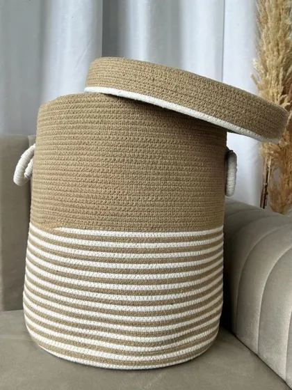 A similar design in beige and white, this large rope basket fits perfectly with a neutral or boho home decor theme.