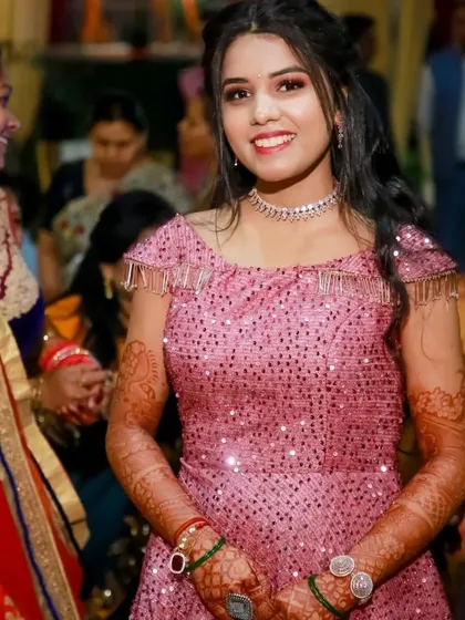 A candid shot of the client enjoying her event in the sparkly pink gown.