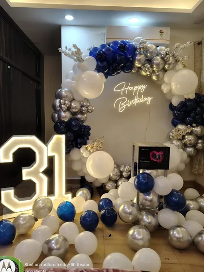 Another view of the sophisticated navy and silver balloon arrangement for the 31st birthday celebration.