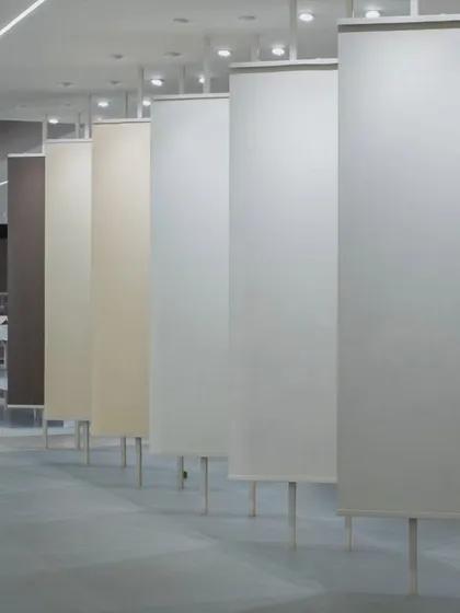 More images from the Krsimar marble showroom, detailing the sliding panel display system and the clean, spacious layout designed for an optimal client experience.