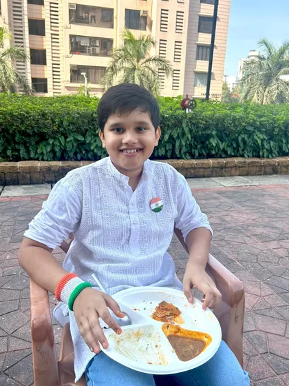 A young guest enjoying his plate at our Republic Day brunch. It's important to me that my menu has delicious options for guests of all ages.