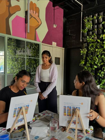 A candid moment during a workshop, offering tips and encouragement to the participants.