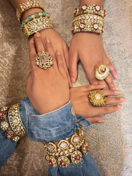 Stack it, mix it, flaunt it. Hands adorned with a variety of our couture bangles and rings, showing how to create a personalized, maximalist look.