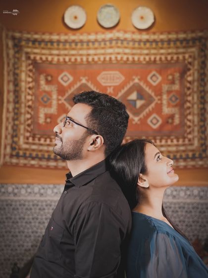 A quiet, contemplative portrait with a beautiful, rustic backdrop. This shot focuses on the couple's connection as they look towards their future together.