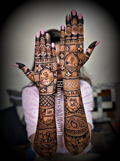 A full view of a unique bridal mehndi, with Punjabi phrases like "Chitta Kukkad" written on the arms. This is a fun and personal way to celebrate culture and family traditions.