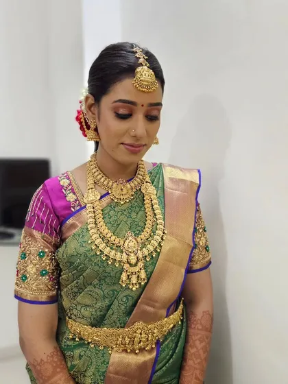 A throwback to Subasini's muhurtham, showing her beautiful green and pink saree and flawless makeup.